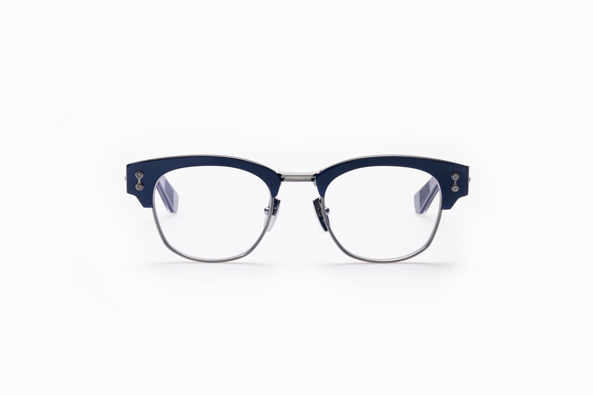 Petite navy titanium eyeglasses sized for narrow faces showing how designer frames fit smaller proportions