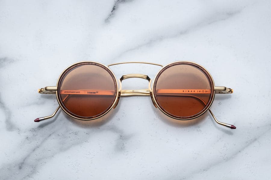 Jacques Marie Mage Ringo 2 round sunglasses in tan acetate with rose lenses representing the best round-frame eyewear designers of 2026