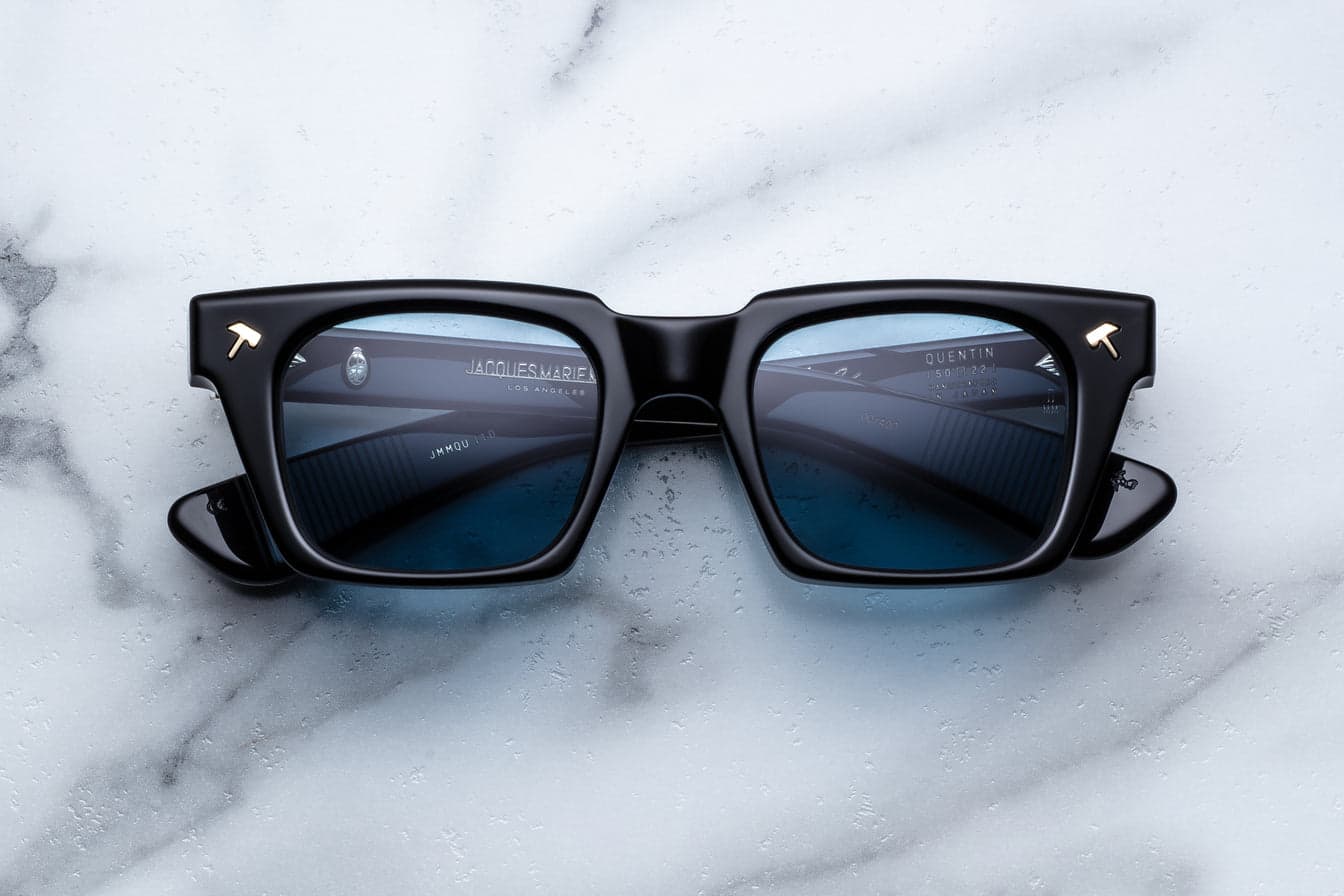 Square sunglasses in dark eclipse acetate showing the kind of bold square frame that flatters round faces